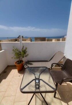 The balcony of the first floor apartment with view to the sea