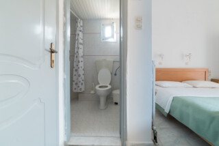 Irini Kamilari apartments, the bedroom and the toilet of room 1